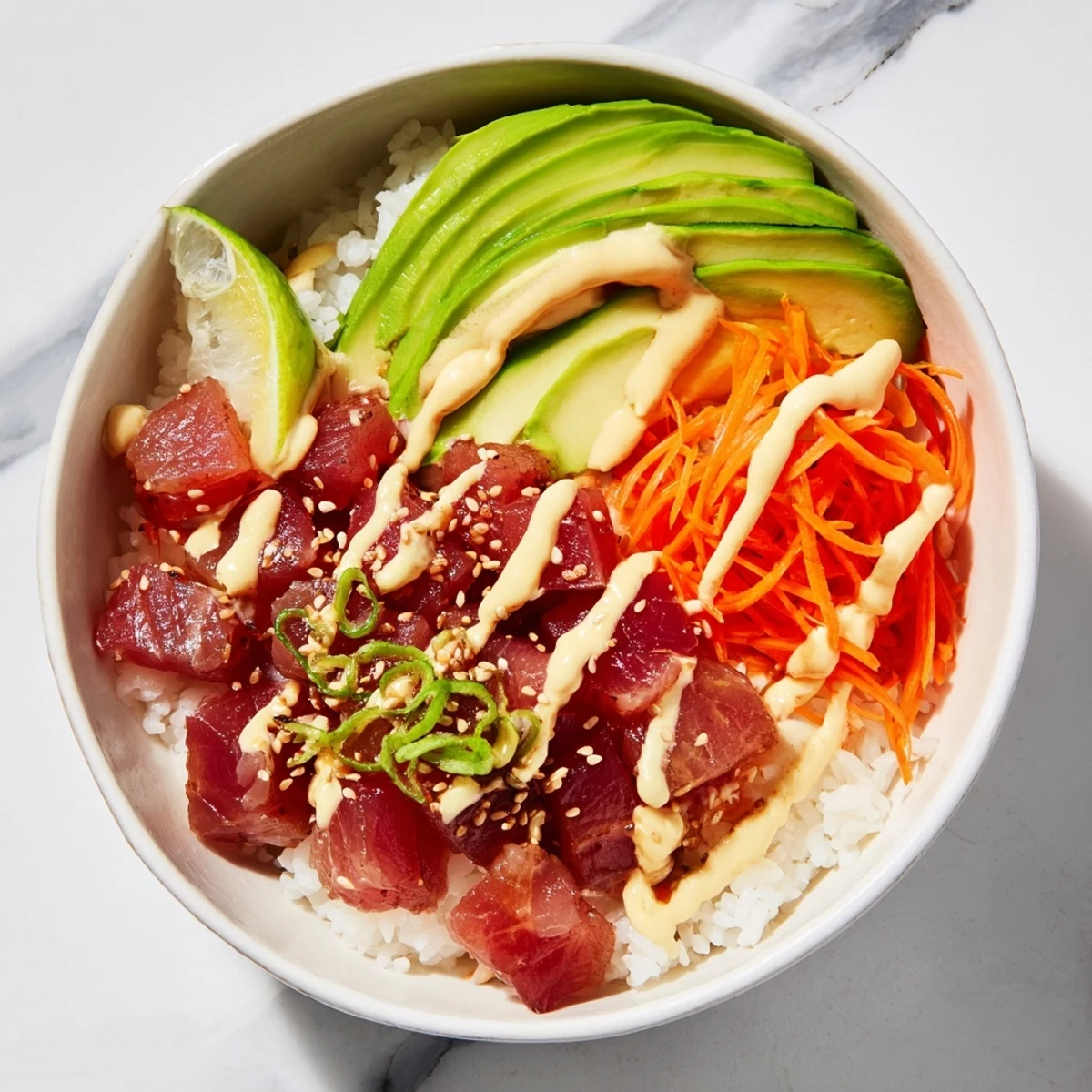 A tempting Spicy Tuna Roll Bowl with creamy spicy mayo drizzled over seasoned sushi rice.