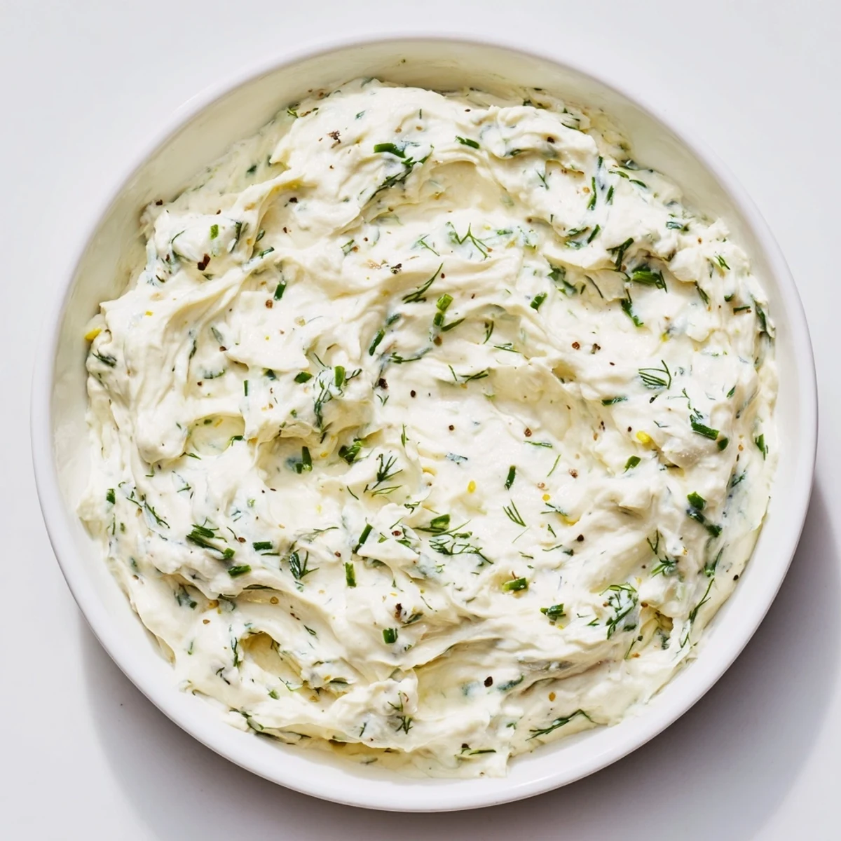 This creamy herb dip looks luxuriously thick, ready to be spread or dipped into for snacking.