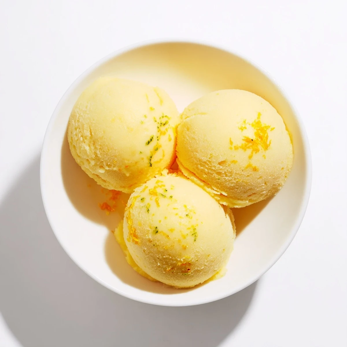 Brightly colored Citrus Sorbet refreshing the palate, perfect for a sunny afternoon treat.