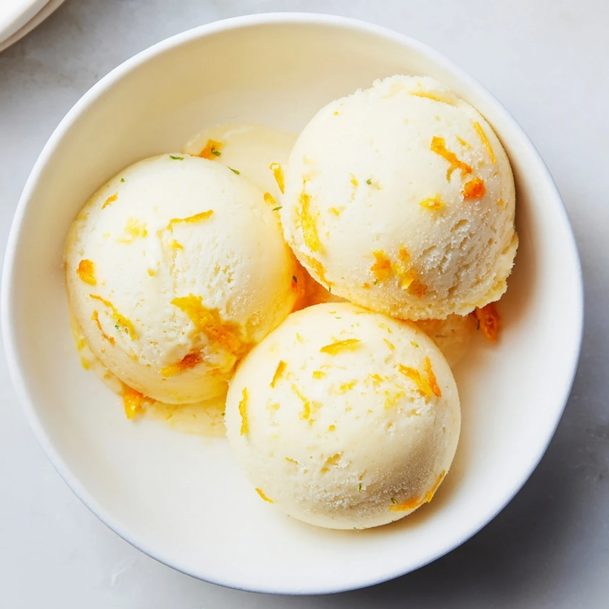 Vibrant photo showing swirling, creamy Citrus Sorbet, a delightful vegan dessert for everyone.