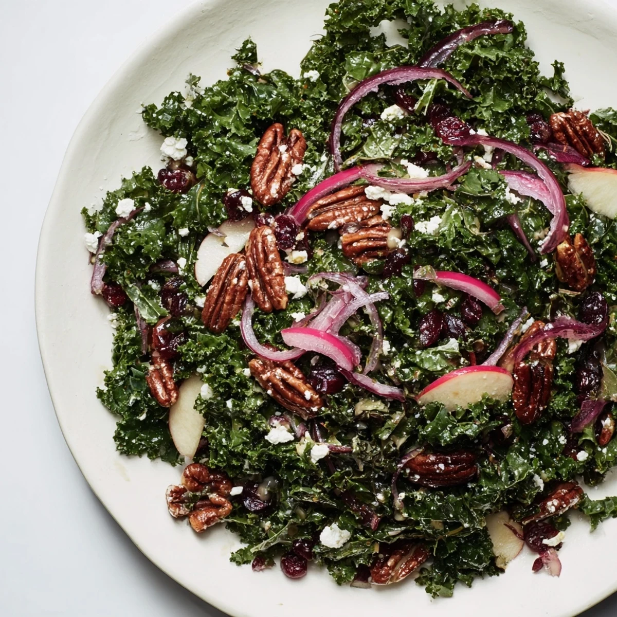 Beautiful closeup of a healthy Winter Kale Salad, perfect for a light lunch or dinner side.