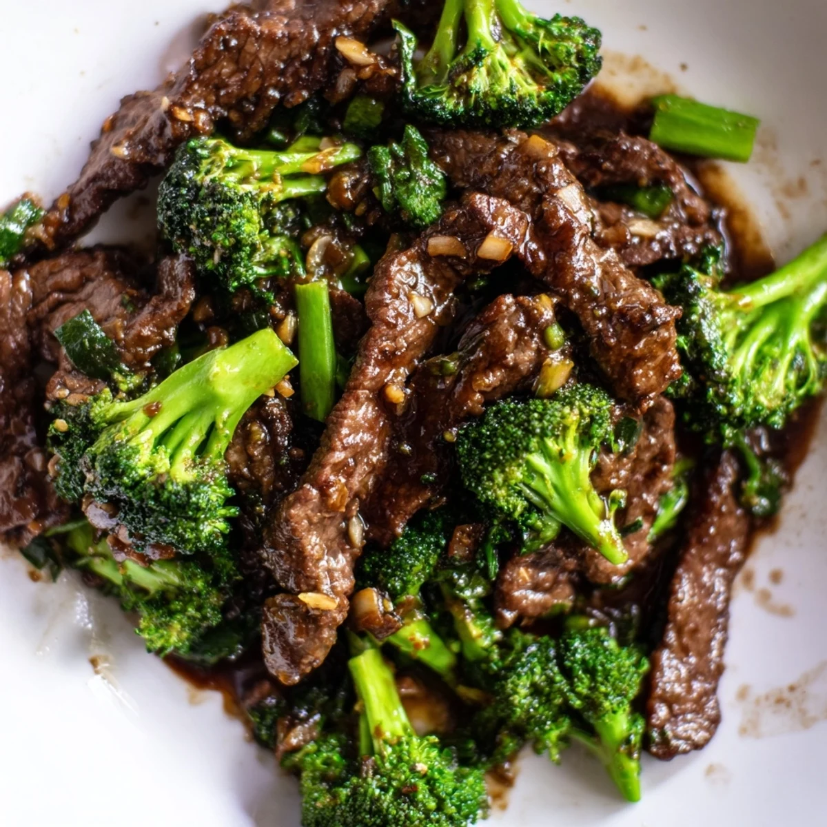 Tender beef strips and fresh green broccoli are stir-fried in a savory oyster sauce, creating a classic Beef and Broccoli Stir Fry.
