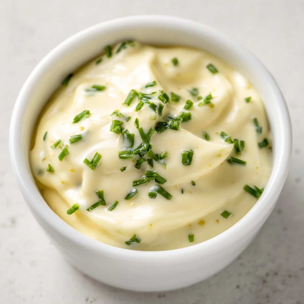 Small bowl of homemade Creamy Salad Dip surrounded by colorful fresh vegetable crudités, perfect for a healthy appetizer platter.