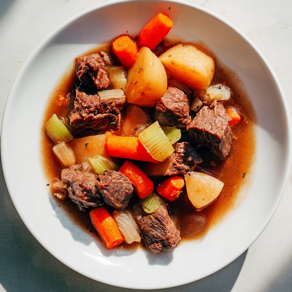 Warm, hearty Slow Cooker Beef Stew, a perfect meal with potatoes, carrots, and savory beef.