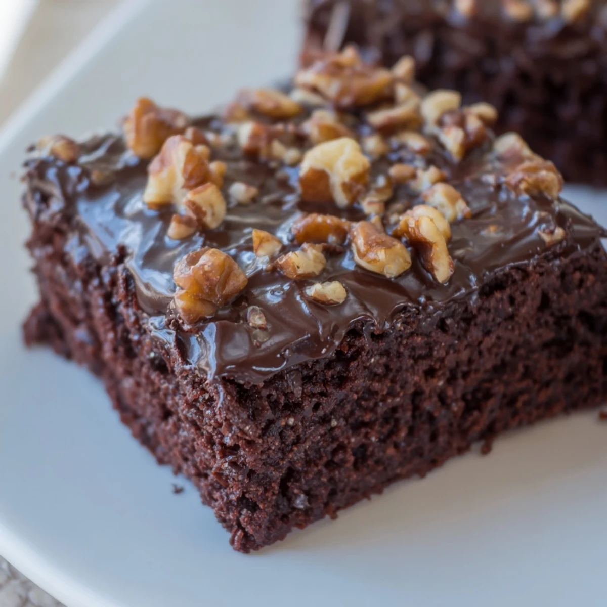 The glossy chocolate frosting and moist texture make these squares perfect for a dessert party.