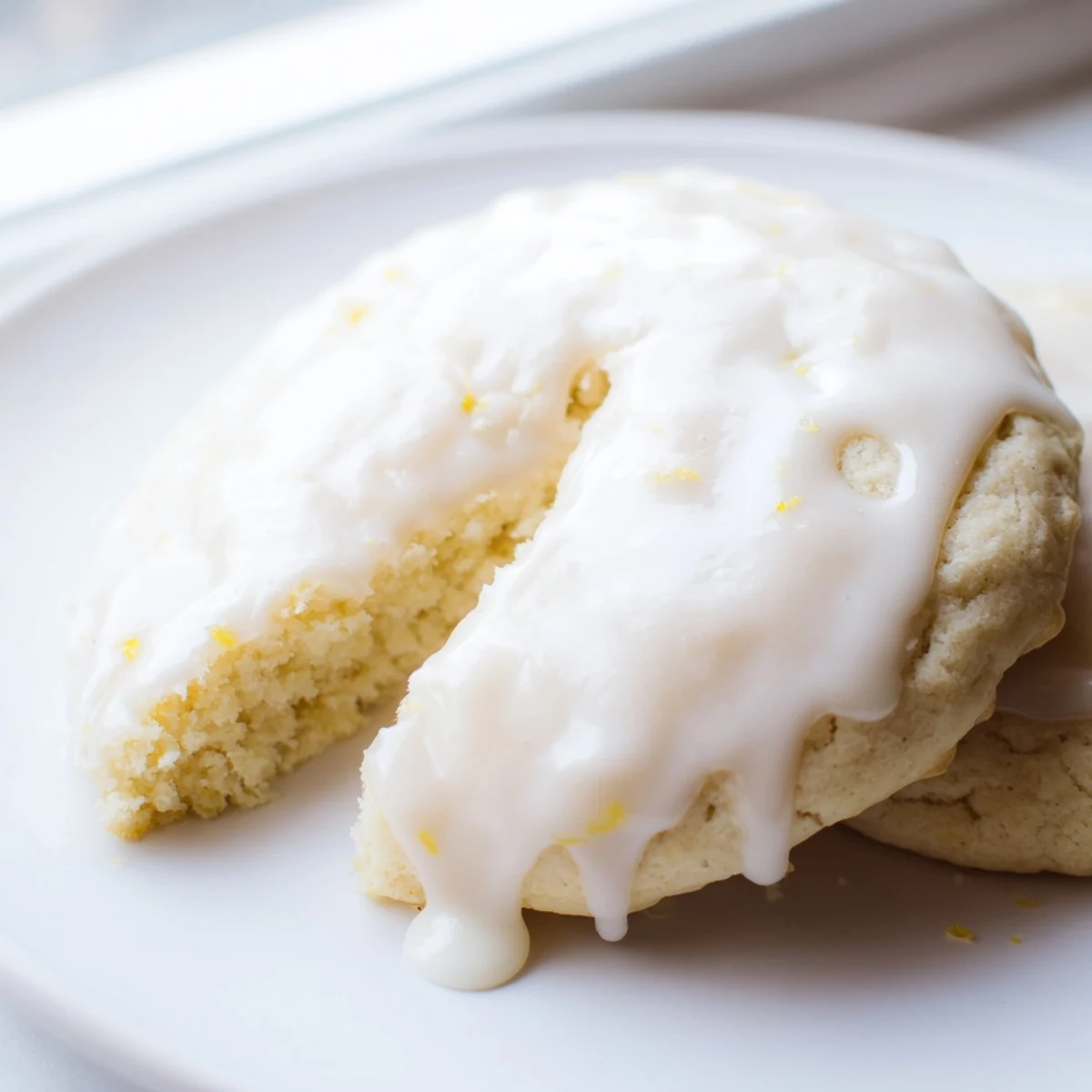 Freshly baked Lemon Ricotta Cookies dusted with lemon zest and drizzled with bright glaze, perfect for afternoon tea.
