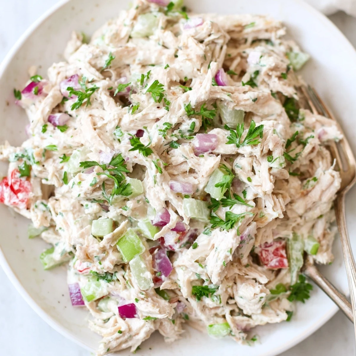 Creamy Greek yogurt rotisserie chicken salad loaded with colorful diced vegetables and fresh herbs