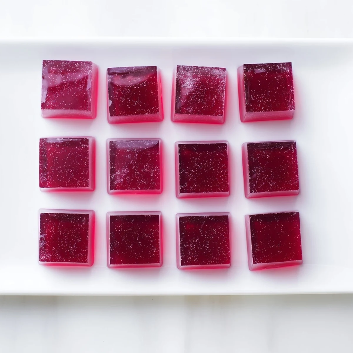 Colorful probiotic jello snacks set in silicone molds with fresh fruit juice