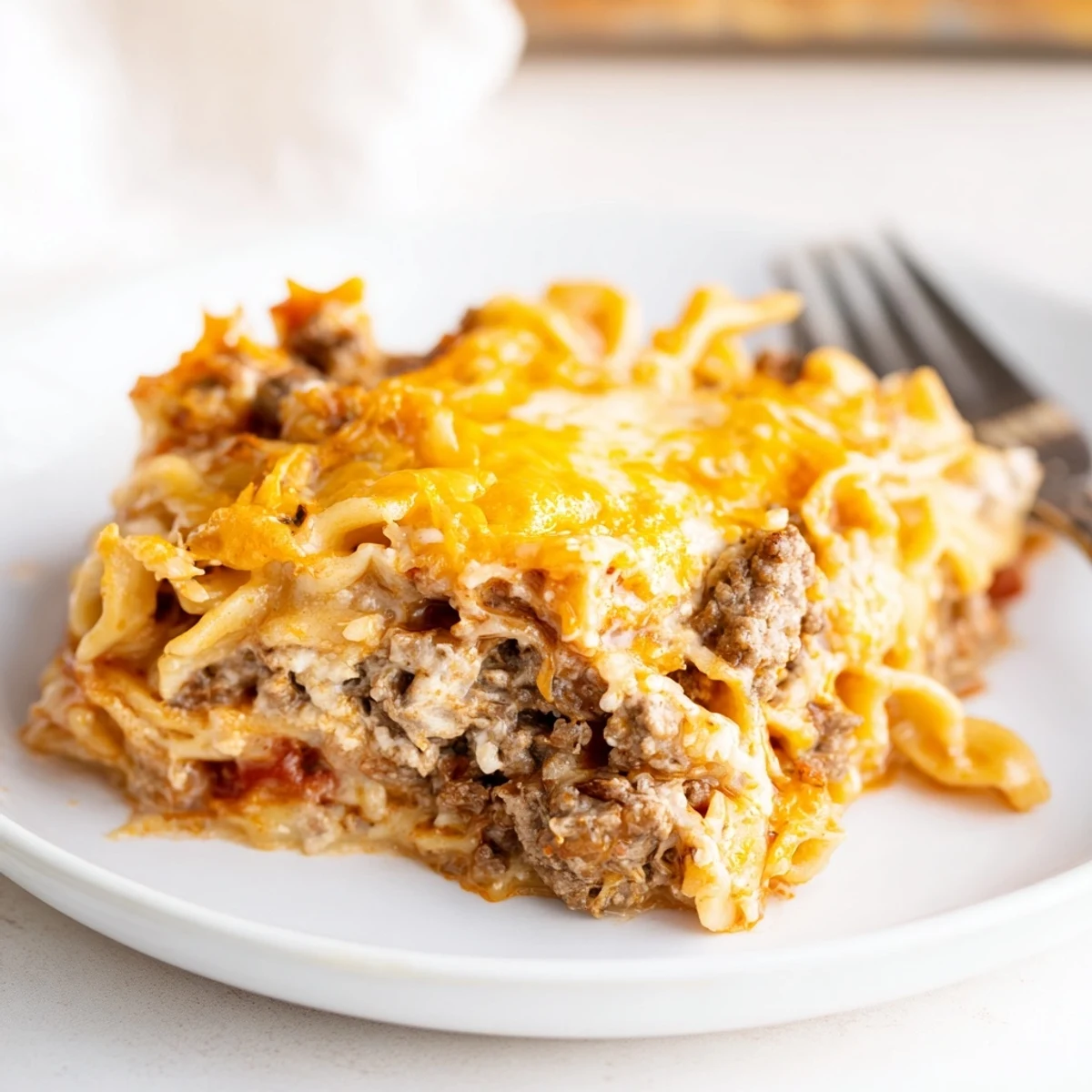 Fork-ready Beef Lombardi Casserole layered with creamy cottage cheese and noodles