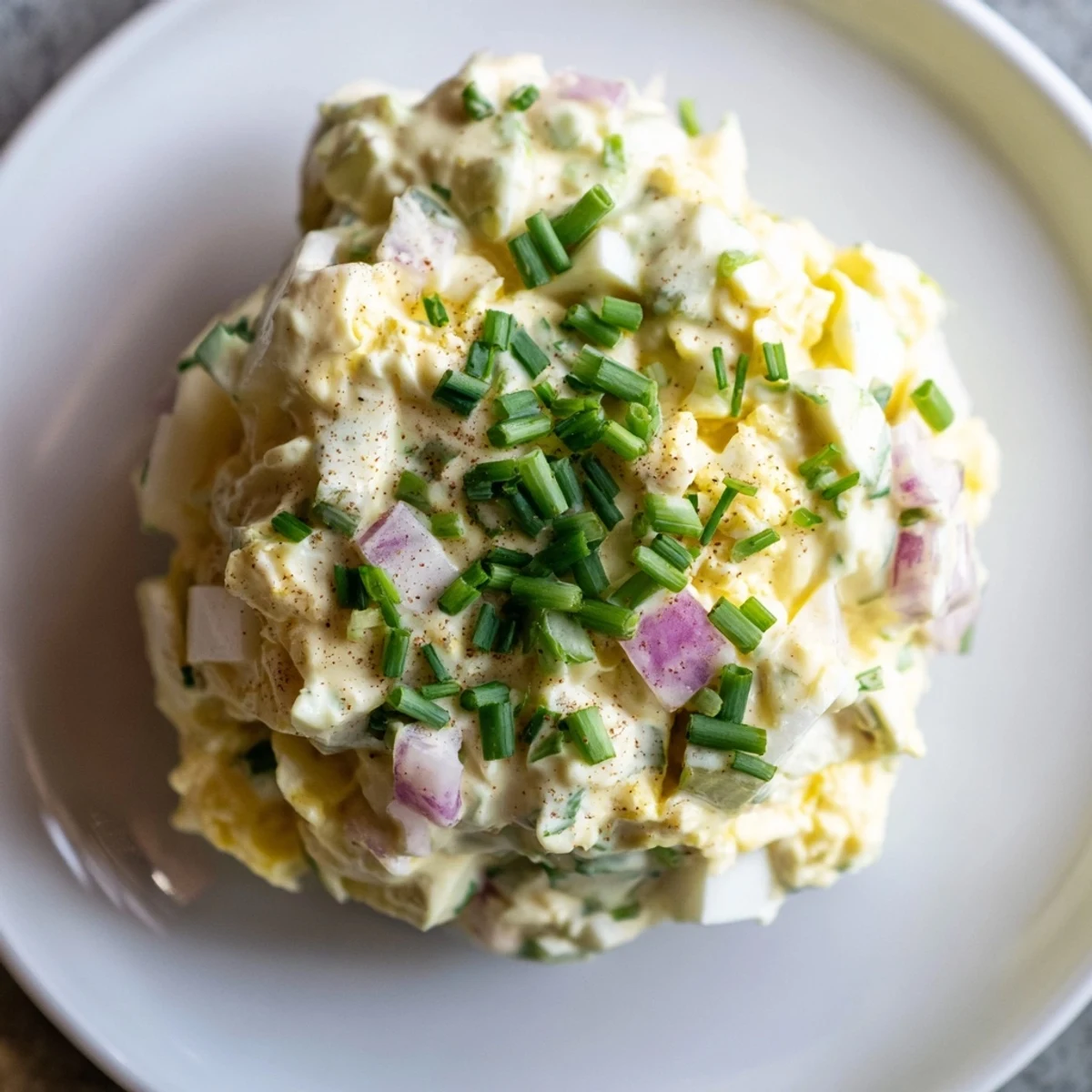 Classic Egg Salad recipe piled on toasted rye, creamy, bright lemon zest.