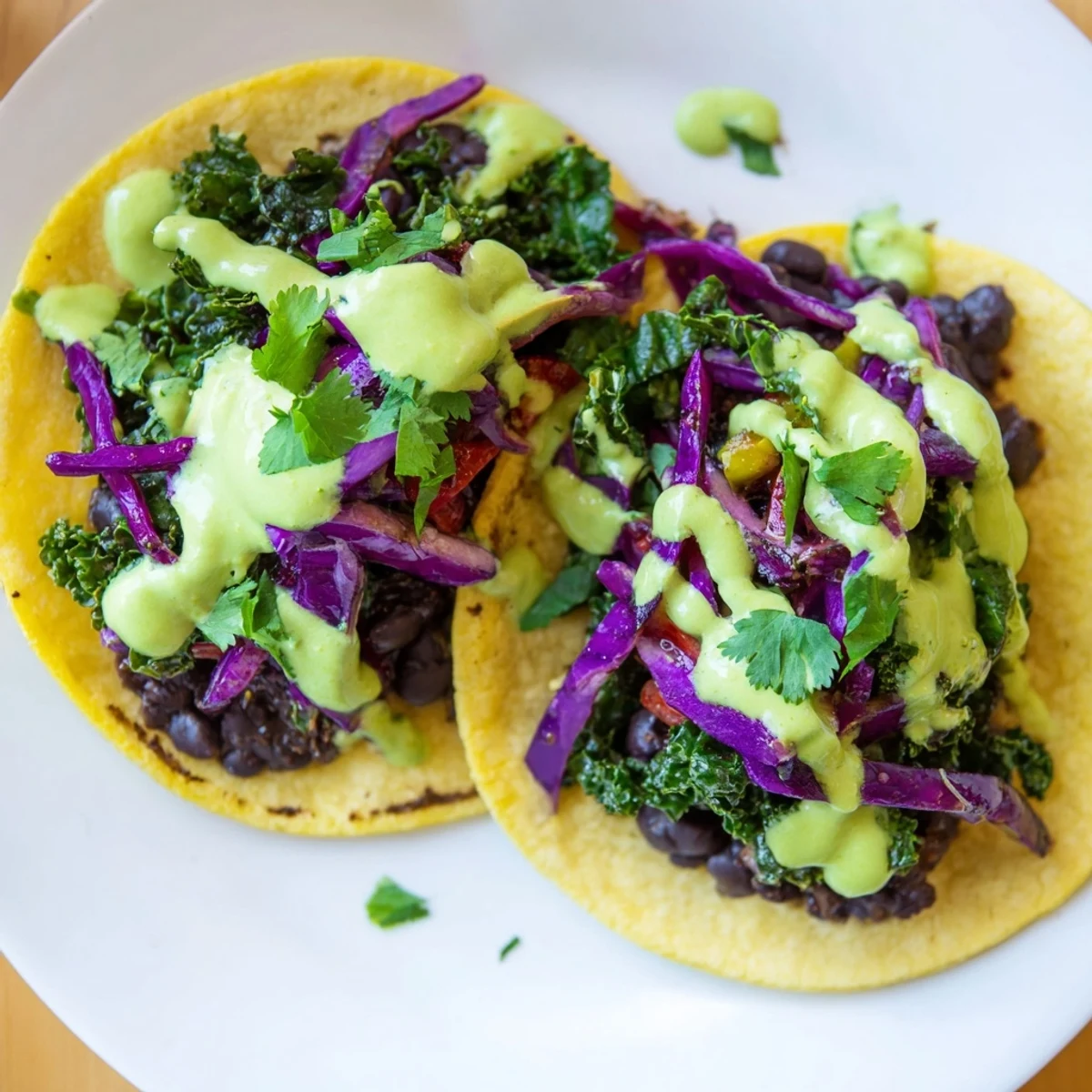 Warm corn tortillas piled high with smoky black beans and tender sautéed kale