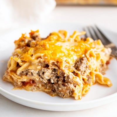 Fork-ready Beef Lombardi Casserole layered with creamy cottage cheese and noodles
